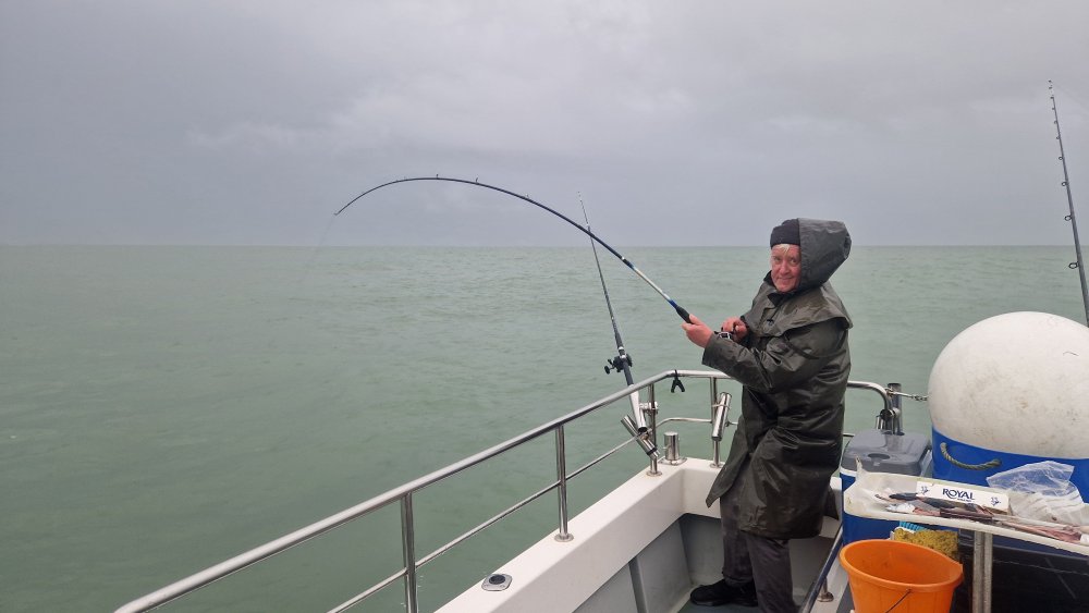 Colin fish on in teh rain.jpg